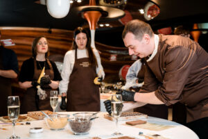 Chocolatier demonstrating how to make chocolates